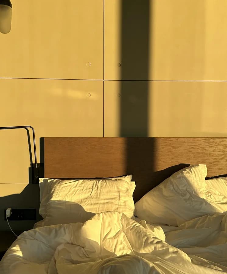 A made-up bed in a KeyGo apartment